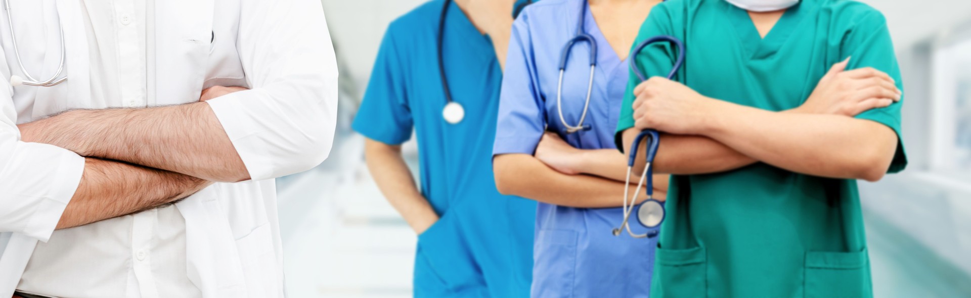 Doctor working in hospital with other doctors.